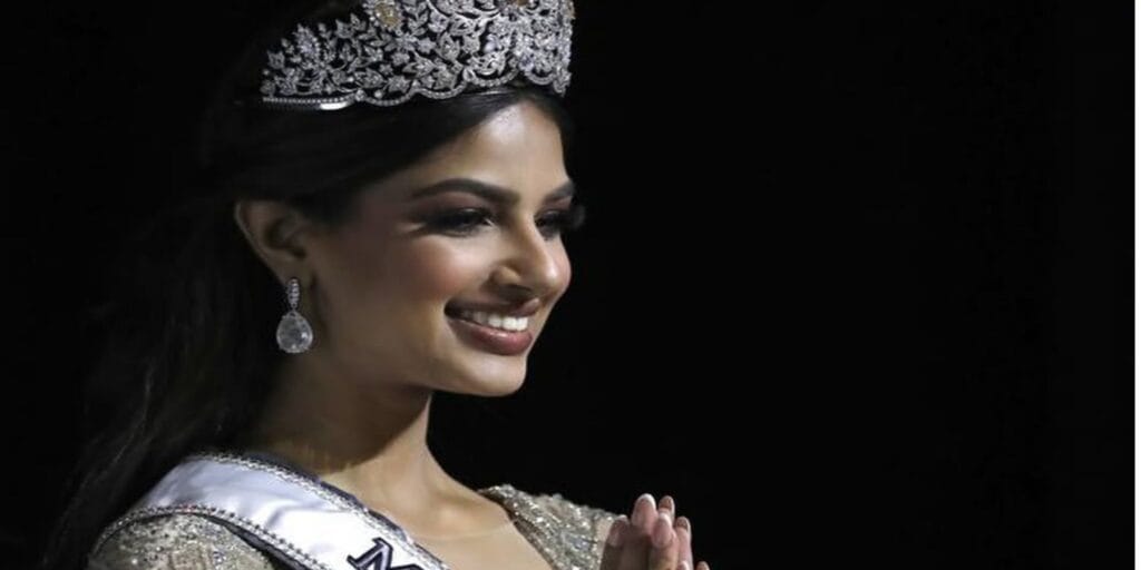 Harnaaz Sandhu wearing Miss Universe 2021 crown on stage Image Credit: Official Instagram – @harnaazsandhu_03